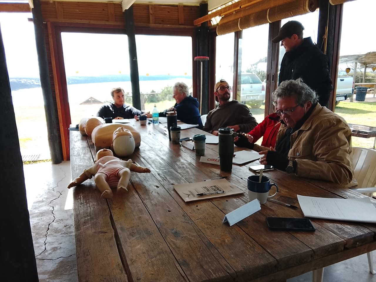 First AID Emergency Care hands-on training session with students and CPR mannequins in the Garden Route